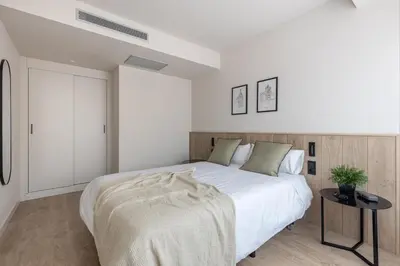 Cama o camas de una habitación en Líbere Madrid Chamberí