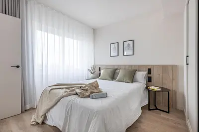 Cama o camas de una habitación en Líbere Madrid Chamberí