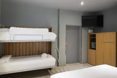 Cama o camas de una habitación en Petit Palace Tres Cruces