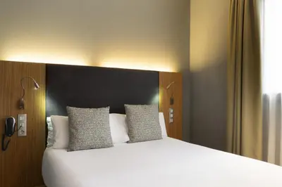 Cama o camas de una habitación en Petit Palace Tres Cruces