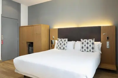 Cama o camas de una habitación en Petit Palace Plaza del Carmen