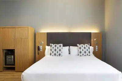 Cama o camas de una habitación en Petit Palace Plaza del Carmen