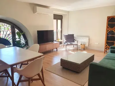 Una televisión o centro de entretenimiento en Luxury Apartment Museum Mile Atocha 2