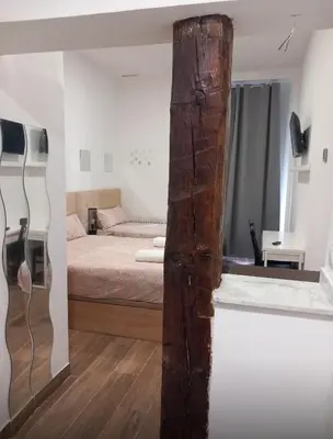 Cama o camas de una habitación en Infantas Corazón de Chueca 3