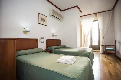 Cama o camas de una habitación en Pensión Carrera