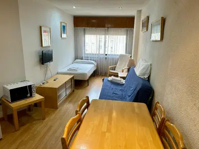 Una televisión o centro de entretenimiento en Apartamentos Goya 75