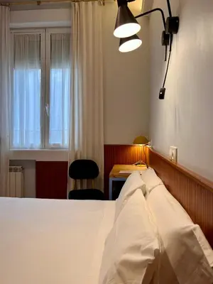 Cama o camas de una habitación en Hostal La Vera