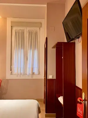 Cama o camas de una habitación en Hostal La Vera