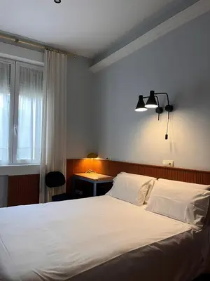 Cama o camas de una habitación en Hostal La Vera