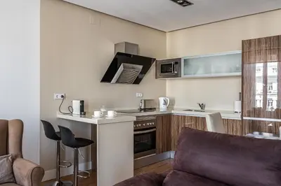 Una cocina o zona de cocina en Waou Apartamentos en Sol Deluxe 1