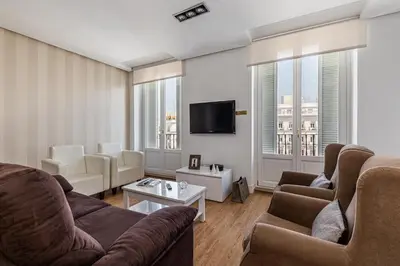 Una televisión o centro de entretenimiento en Waou Apartamentos en Sol Deluxe 1