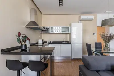 Una cocina o zona de cocina en Waou Apartamentos en Sol Deluxe 2