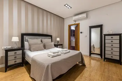 Cama o camas de una habitación en Waou Apartamentos en Sol Deluxe 2