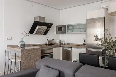 Una cocina o zona de cocina en Waou Apartamentos en Sol Deluxe 3