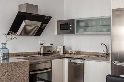 Una cocina o zona de cocina en Waou Apartamentos en Sol Deluxe 3