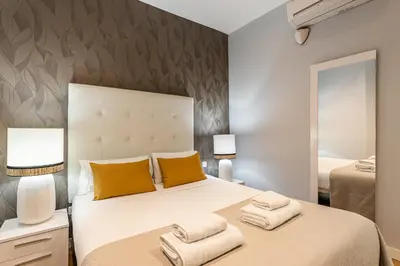 Cama o camas de una habitación en Waou Apartamentos en Sol Superior 1