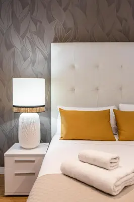 Cama o camas de una habitación en Waou Apartamentos en Sol Superior 1