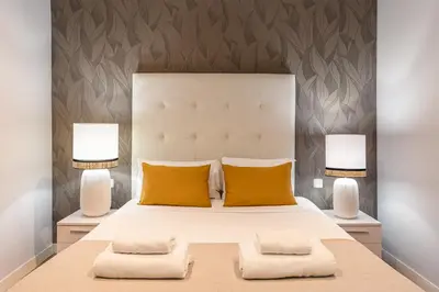 Cama o camas de una habitación en Waou Apartamentos en Sol Superior 1