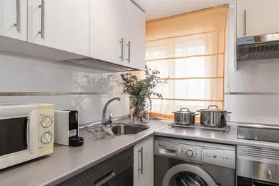 Una cocina o zona de cocina en Waou Apartamentos en Sol Confort 1