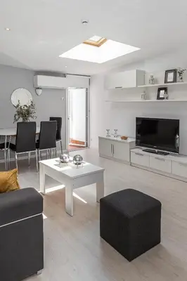 Una televisión o centro de entretenimiento en Waou Apartamentos en Sol Confort 1