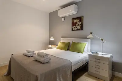 Cama o camas de una habitación en Waou Apartamentos en Sol Confort 2