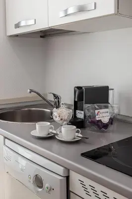 Una cocina o zona de cocina en Waou Apartamentos en Sol Confort 2