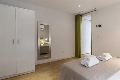 Cama o camas de una habitación en Waou Apartamentos en Sol Confort 2