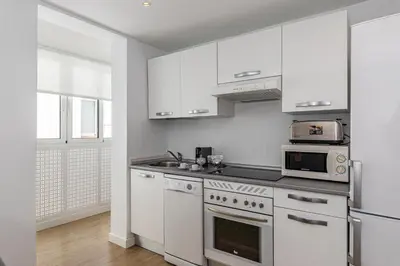 Una cocina o zona de cocina en Waou Apartamentos en Sol Confort 2