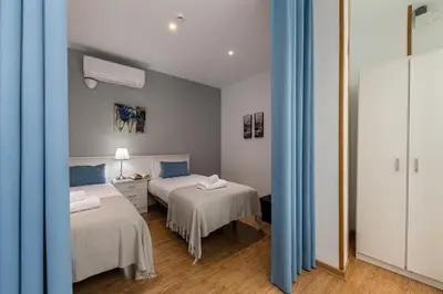 Cama o camas de una habitación en Waou Apartamentos en Sol Confort 3