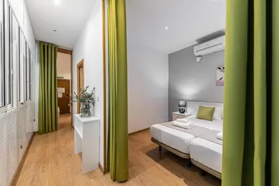 Cama o camas de una habitación en Waou Apartamentos en Sol Confort 4