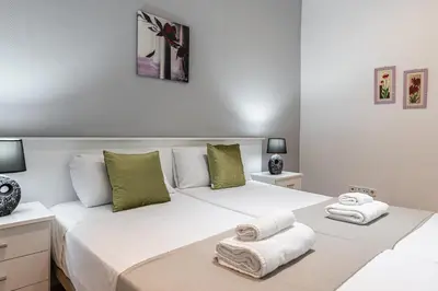 Cama o camas de una habitación en Waou Apartamentos en Sol Confort 4