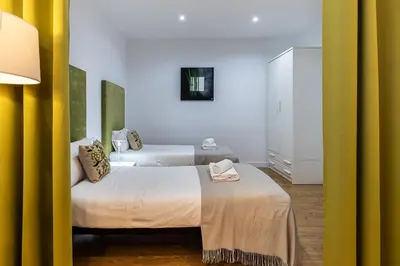 Cama o camas de una habitación en Waou Apartamentos en Sol Confort 5
