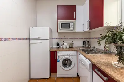 Una cocina o zona de cocina en Waou Apartamentos en Sol Confort 5