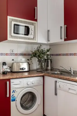 Una cocina o zona de cocina en Waou Apartamentos en Sol Confort 5