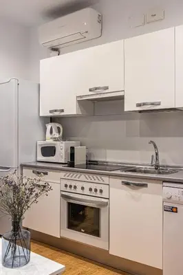 Una cocina o zona de cocina en Waou Apartamentos en Sol Confort 7
