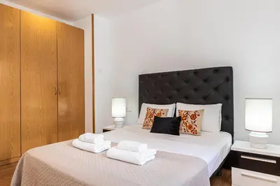 Cama o camas de una habitación en Waou Apartamentos en Sol Confort 8