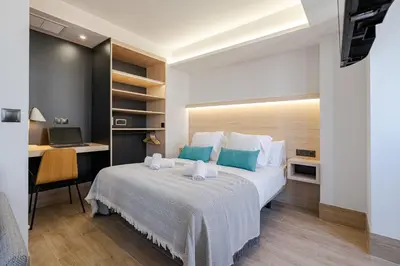 Cama o camas de una habitación en Feelathome Ventas Suites