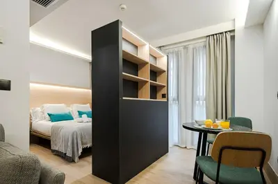 Cama o camas de una habitación en Feelathome Ventas Suites