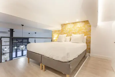 Cama o camas de una habitación en Apartamento Bernabeu Loft en Madrid