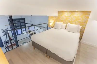 Cama o camas de una habitación en Apartamento Bernabeu Loft en Madrid