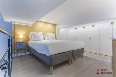 Cama o camas de una habitación en Apartamento Bernabeu Loft en Madrid
