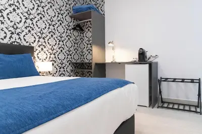 Cama o camas de una habitación en Hostal Boutique I Host You