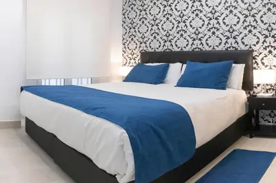 Cama o camas de una habitación en Hostal Boutique I Host You