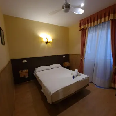 Cama o camas de una habitación en Hostal Oporto