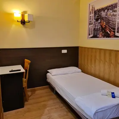 Cama o camas de una habitación en Hostal Oporto