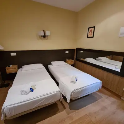 Cama o camas de una habitación en Hostal Oporto