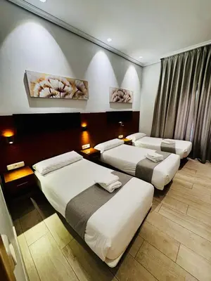 Cama o camas de una habitación en Hostal Cervelo