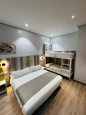 Cama o camas de una habitación en Hostal Cervelo