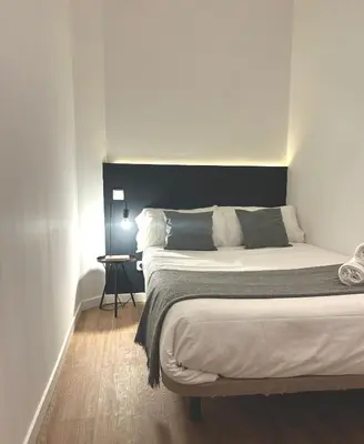 Cama o camas de una habitación en Center Madrid habitaciones