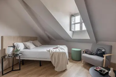 Cama o camas de una habitación en Líbere Madrid Palacio Real